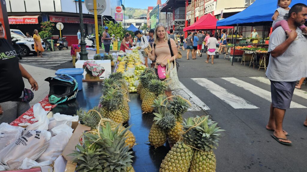 Nora is happy to find fruits from Marquesas at Sunday morning market in Papeete